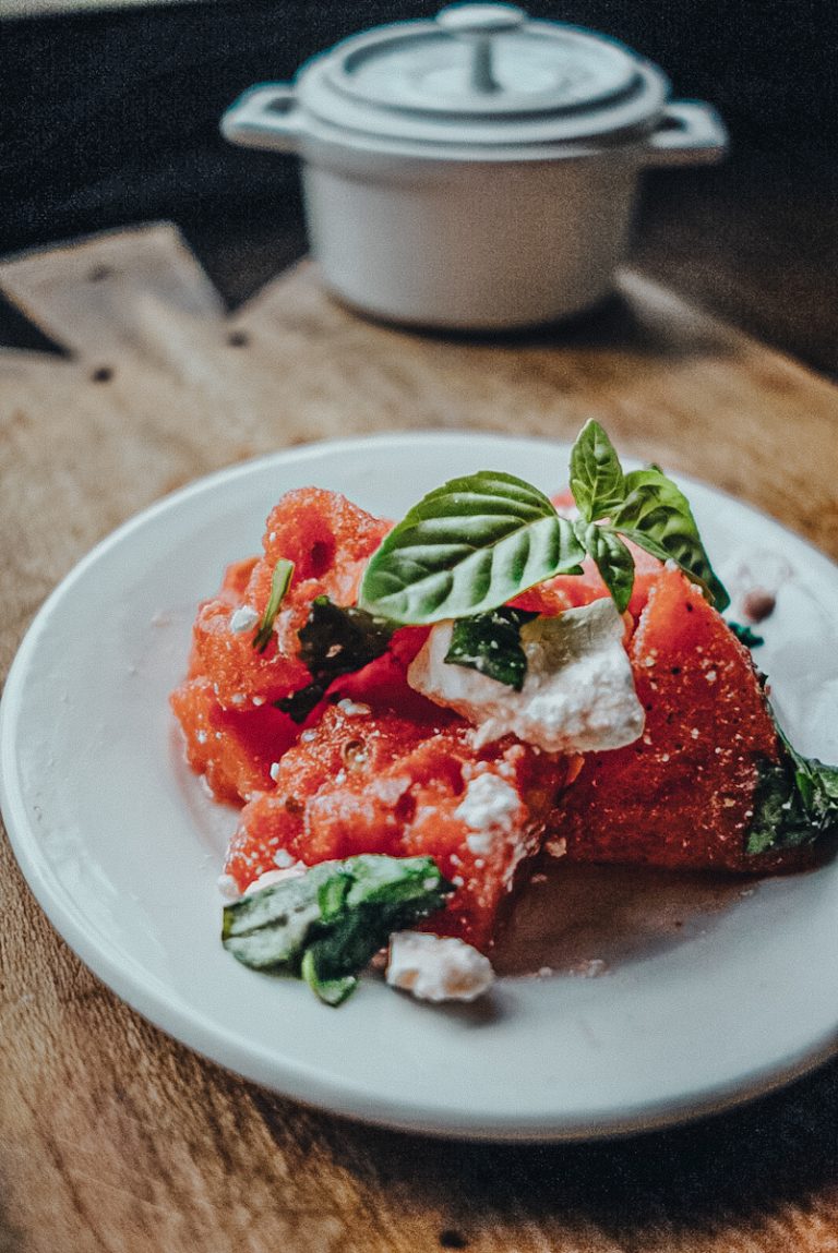 a ironstone plate of watermelon salad