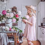 making homemade flower food in a kitchen with a bucket of peonies