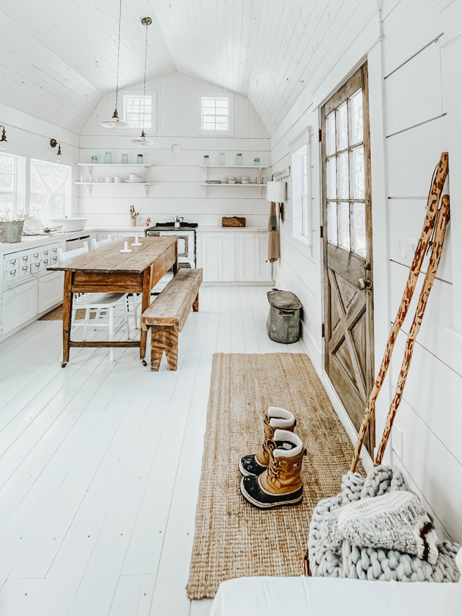 vaulted ceiling in a shed cabin with Scandinavian decor and antiques
