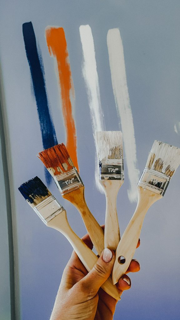 four paint brushes with different home colour selections on them