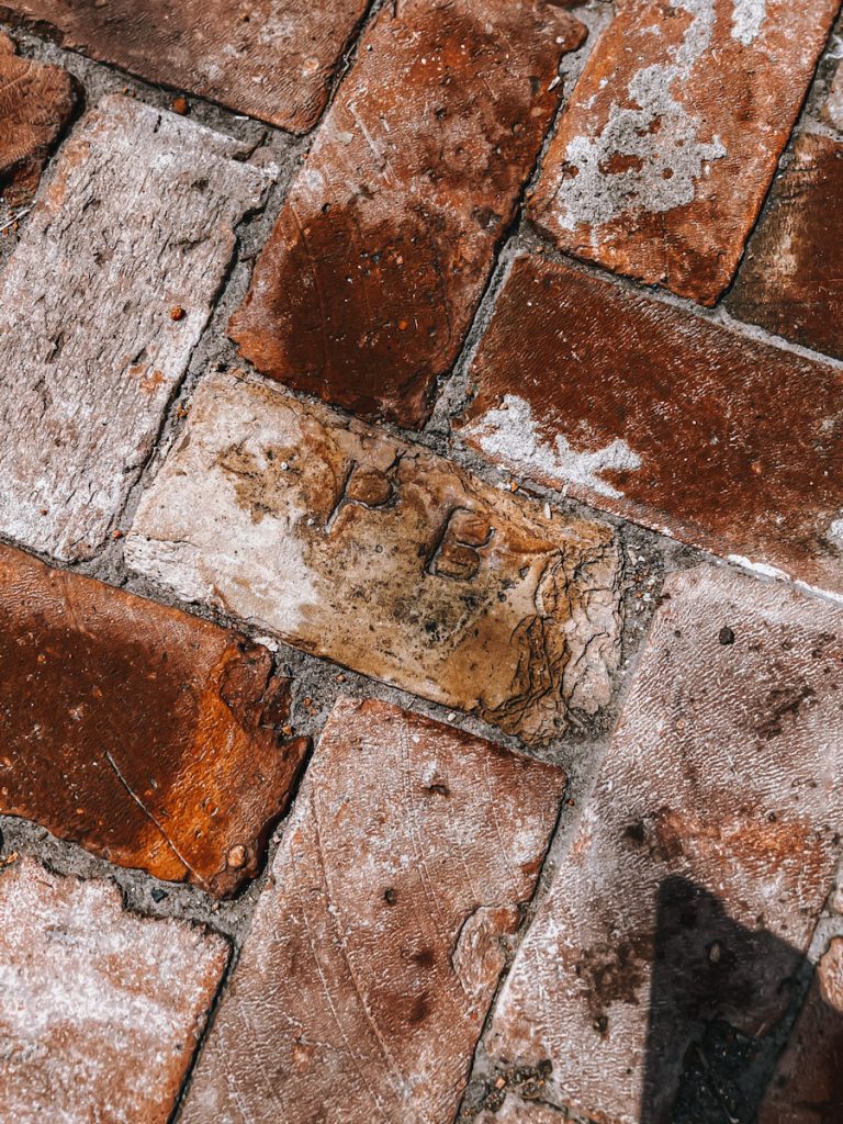 Reclaimed bricks that have been made into a patio but the brick chipped.