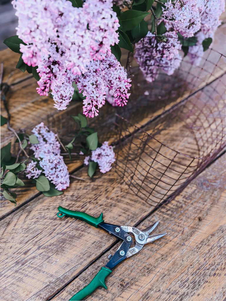 making a wire egg or flower frog for arranging a lilac bouquet