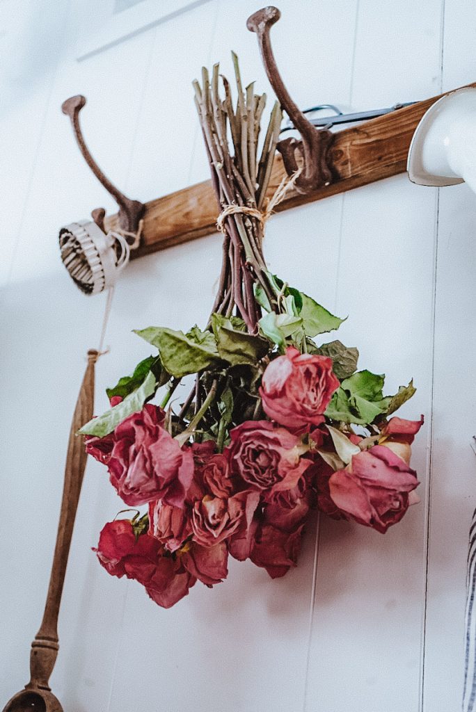 hang drying roses on a hook