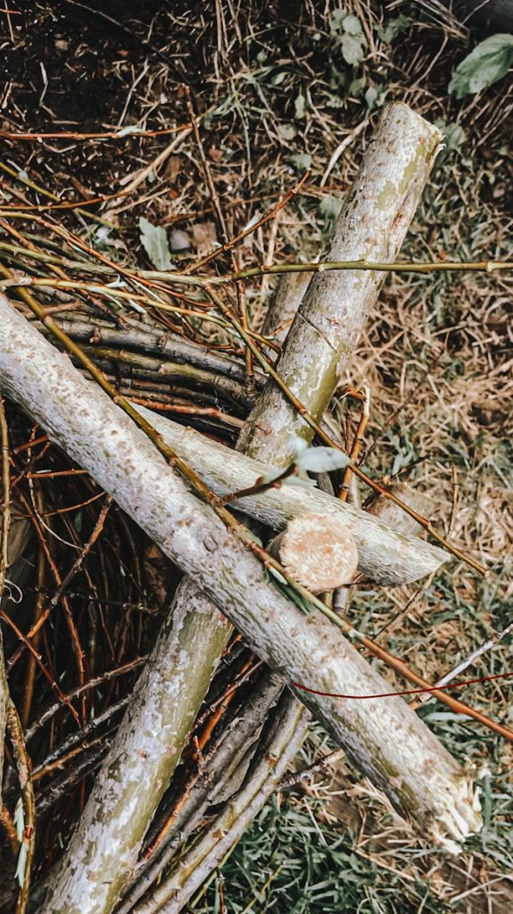 The corner of the wattle fence that is woven to make a garden bed.