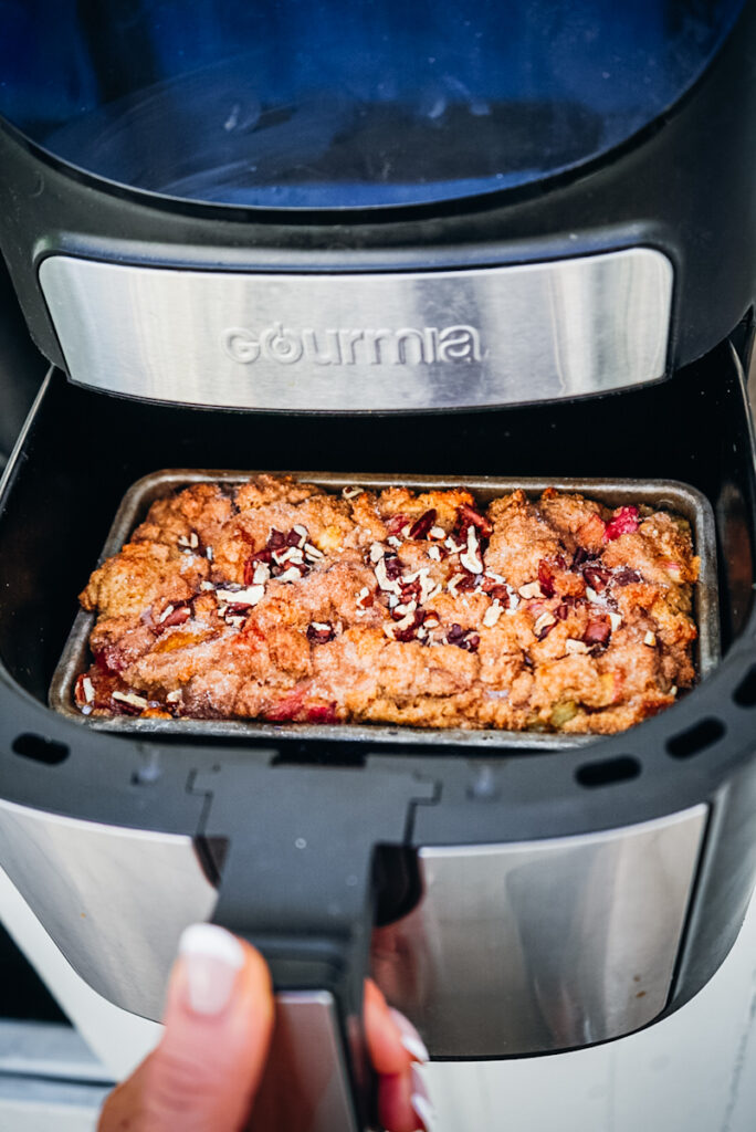 Rhubarb bread in a pan being baked.