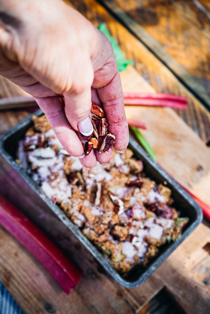 Adding pecans to the rhubarb bread.