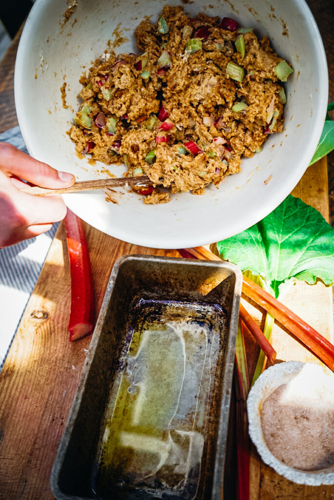 Pouring the rhubarb batter into the bread pan.