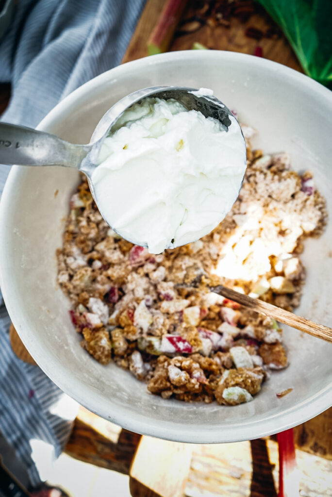 Mixing the wet and dry ingredients of the rhubarb bread.