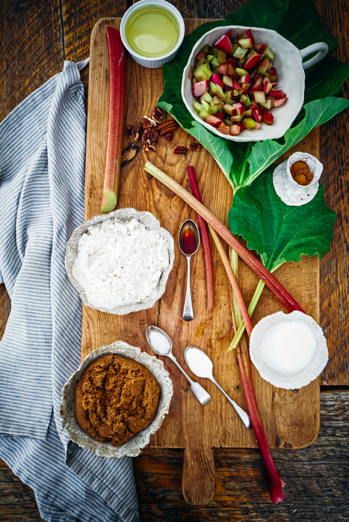 Ingredients for rhubarb bread including rhubarb, flour, oil, salt, sugar, cinnamon, egg, ad greek yogurt.