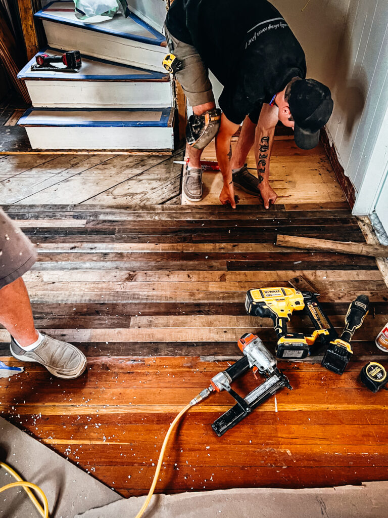 Replacing flooring with salvaged fir floors.