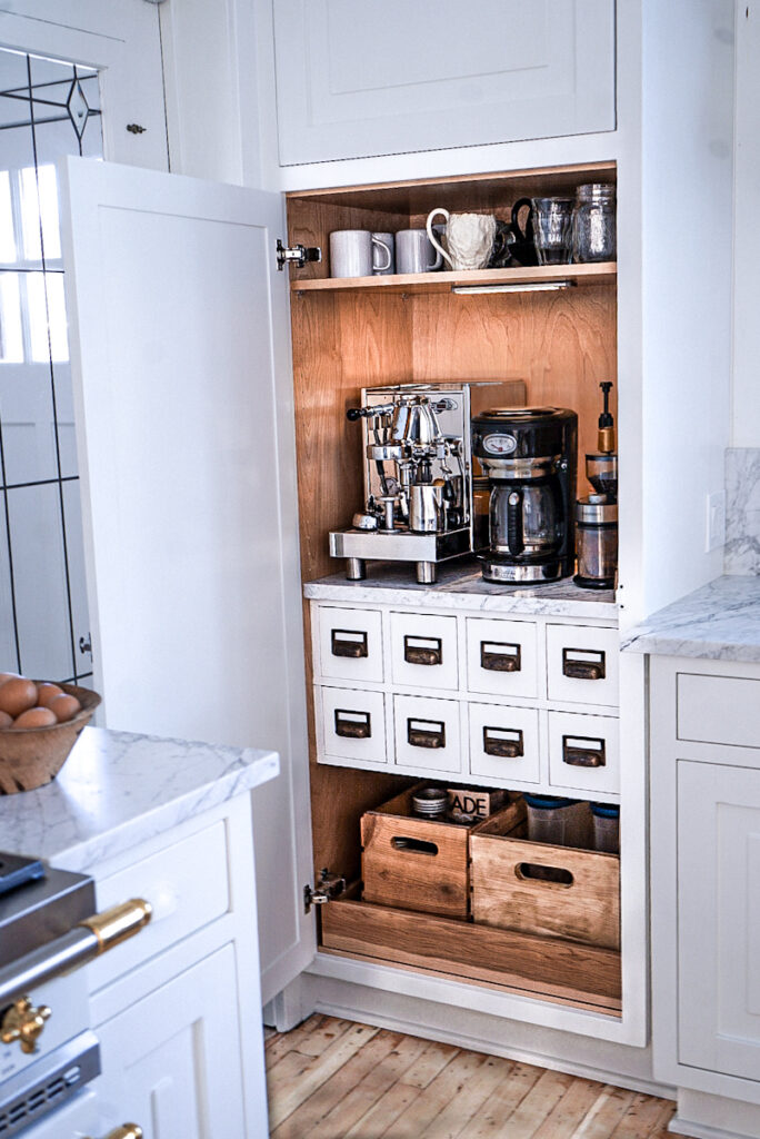 A coffee station with an apothacary cabinet base that can be closed into a cabinet.