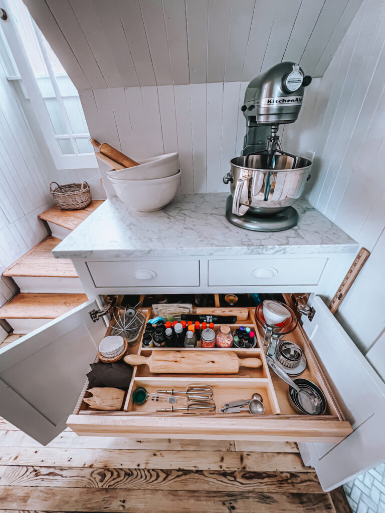 Baking station with an organized pull out drawer full of baking items.