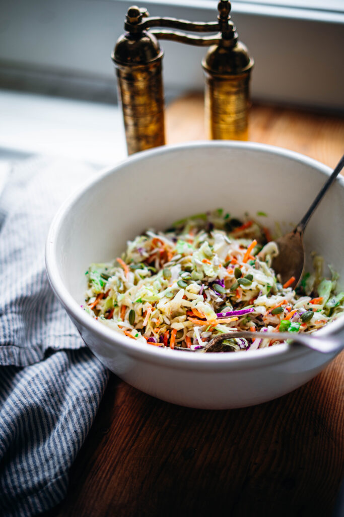 Large bowl of creamy, delicious coleslaw make without mayo.